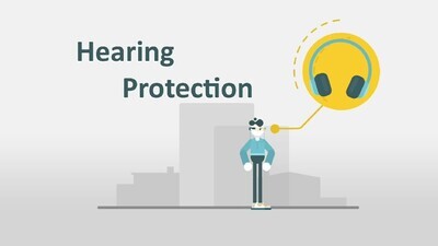 a motion video of a man standing with safety clothing instructions in a factory
