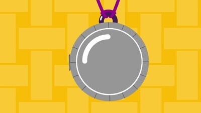 a medal with a photo of a boy and a girl