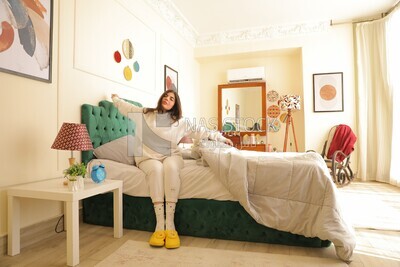a woman sitting in bed waking up
