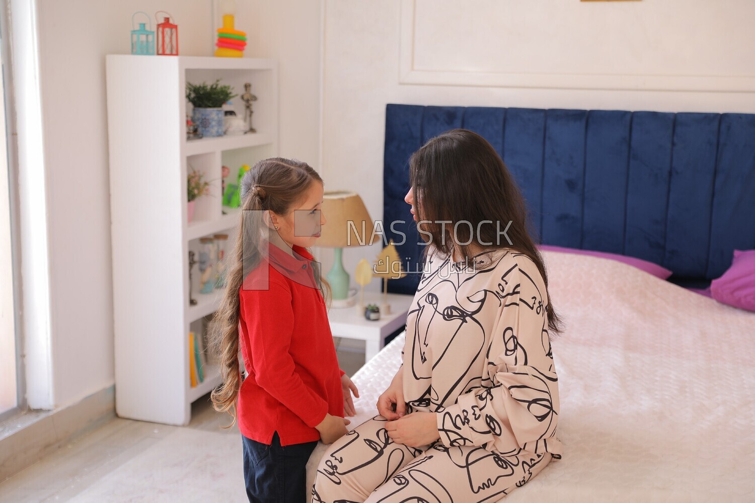 a mother gets her daughter ready for school