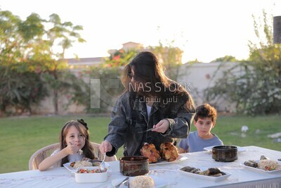 a mother feeding her daughter