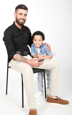 A man sitting on the chair with his boy