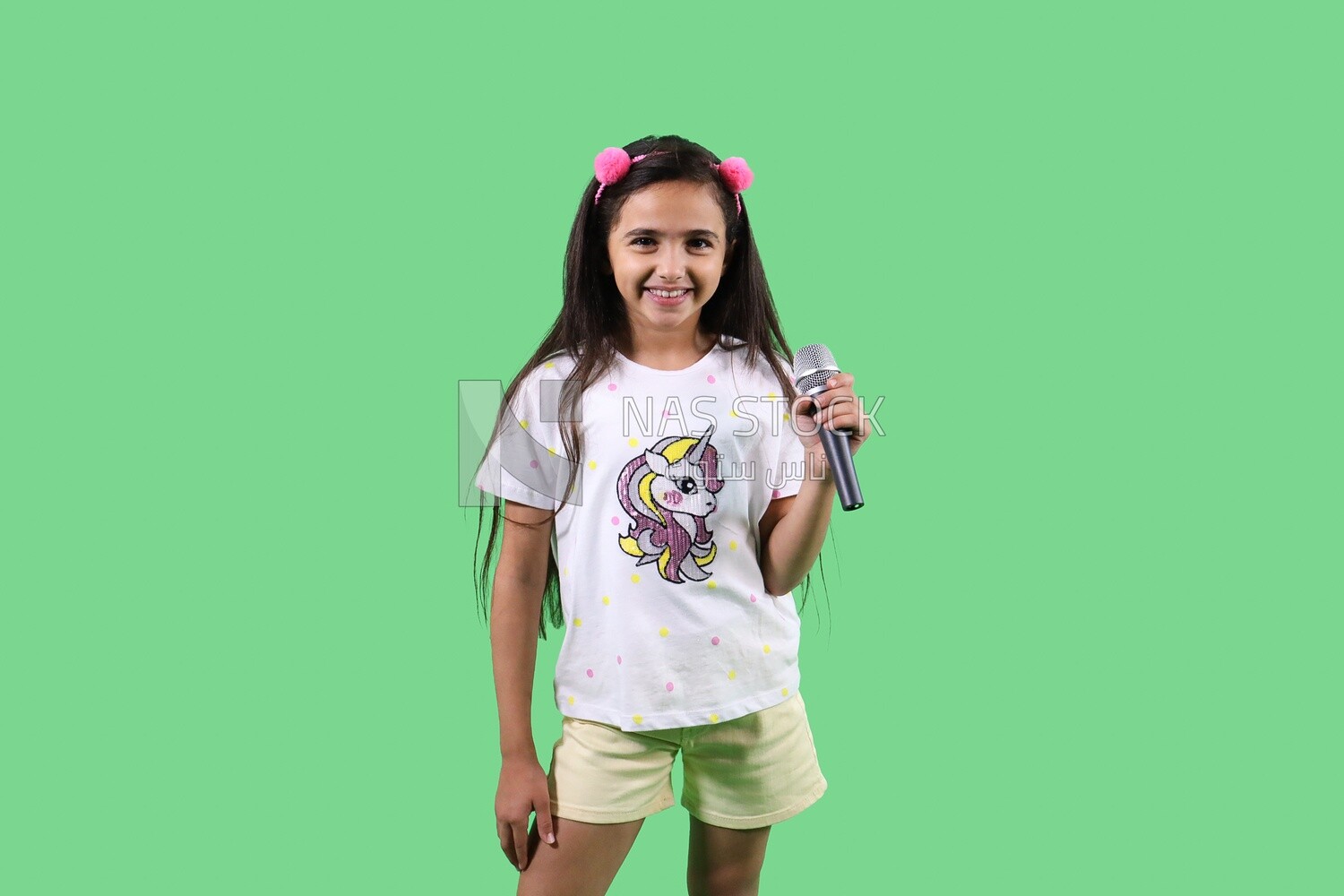 Small girl holding a microphone