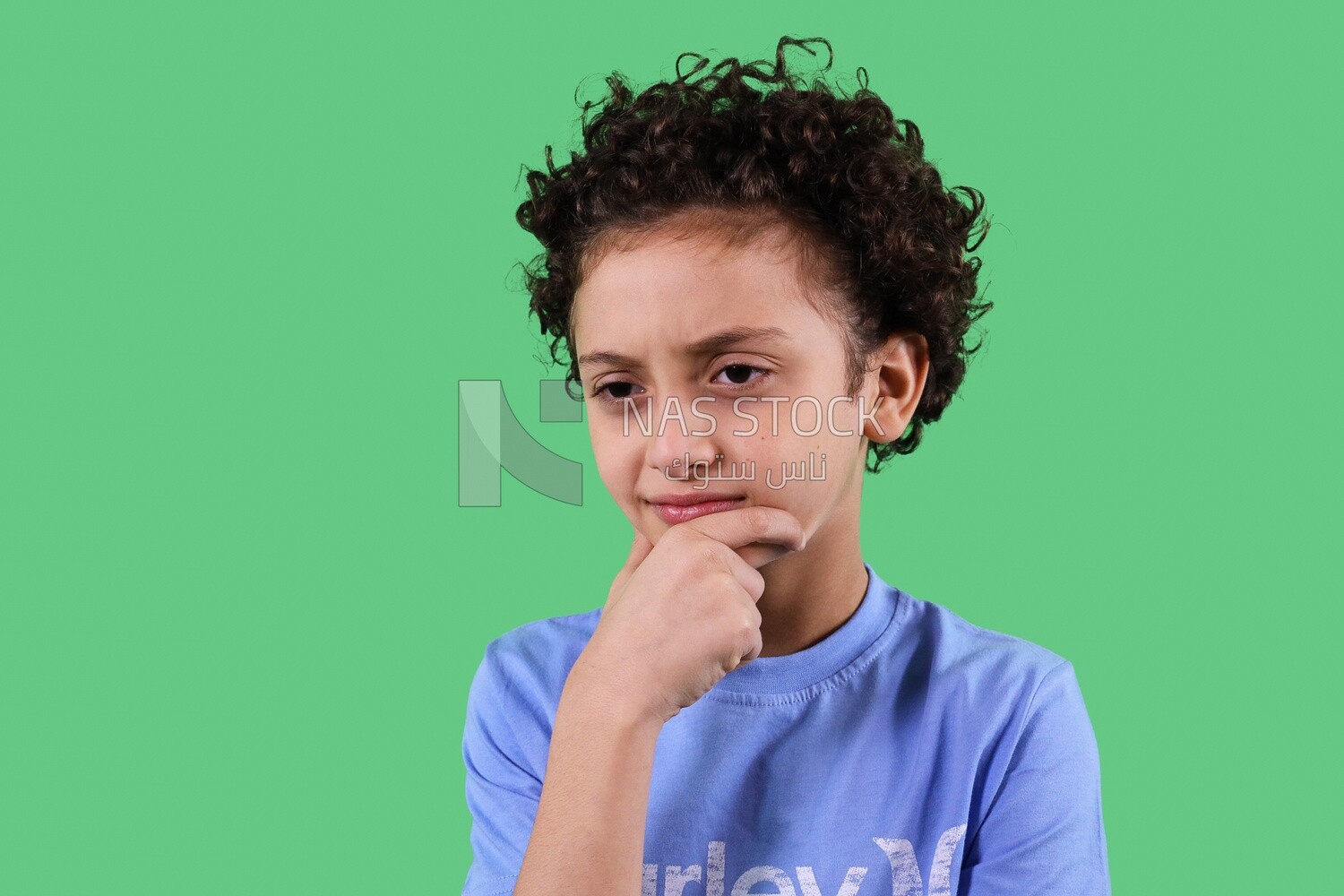 A close up photo of a boy thinking