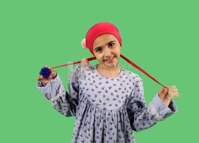 A small girl wearing egyptian farmer&#39;s clothes