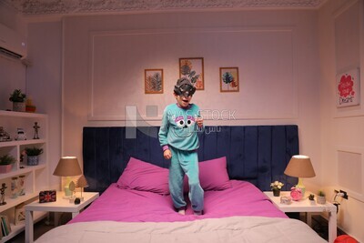a boy wearing a mask looks like a hero trying to fly