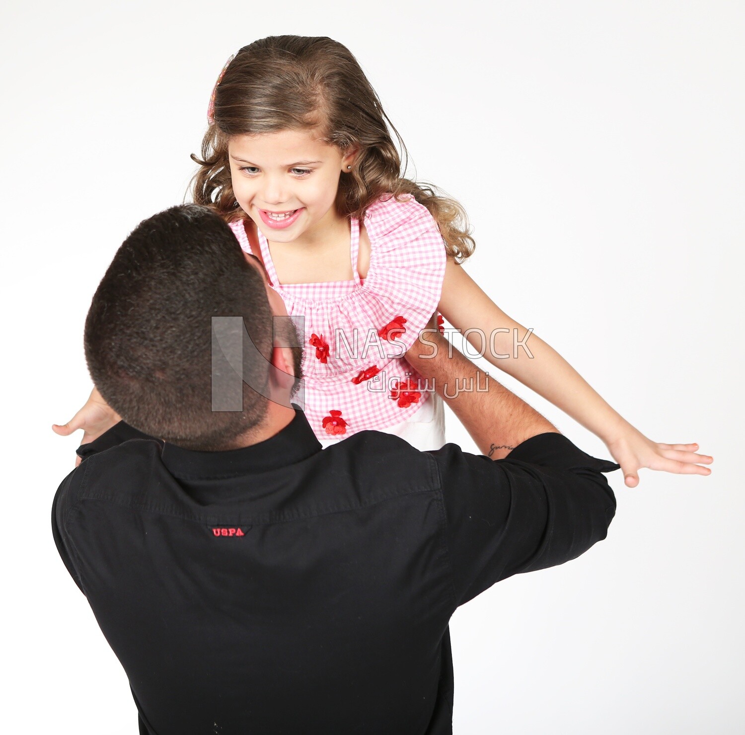 A father carrying his daughter