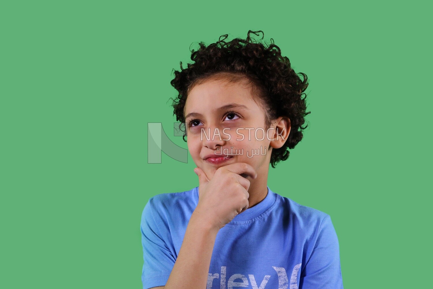 A close up photo of a boy thinking