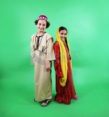 A boy and a girl standing on a green background