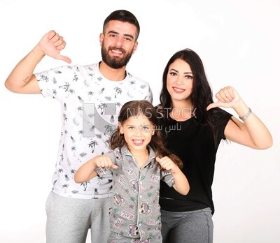 A man and a woman with their daughter