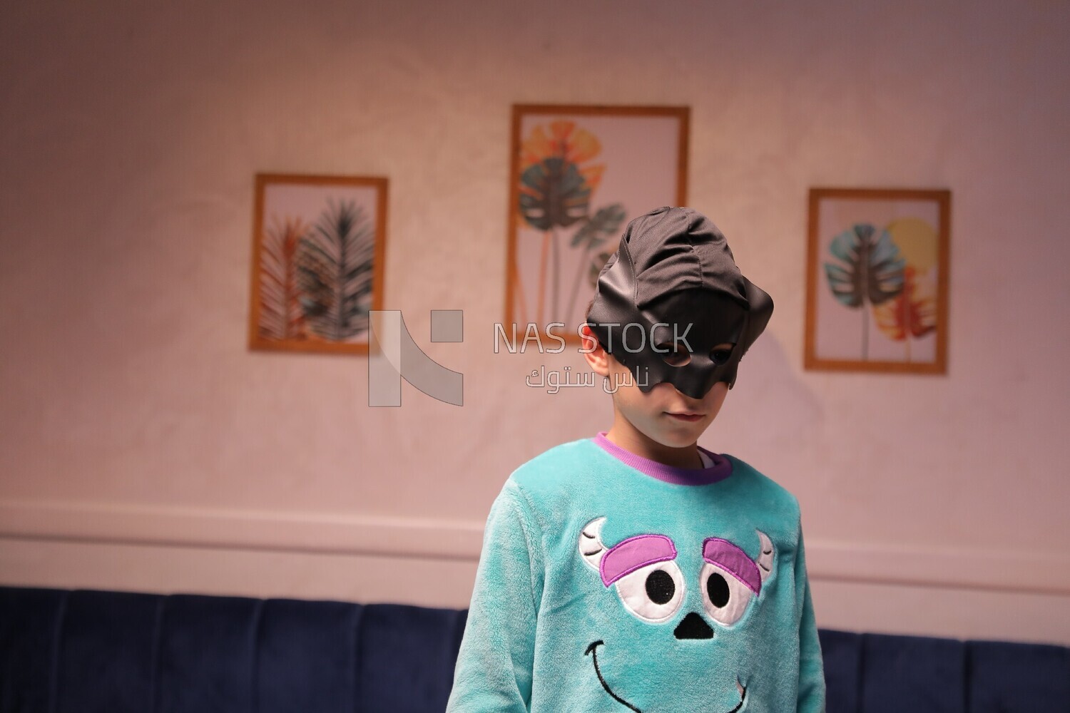a boy wearing a mask looks like a hero trying to fly