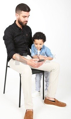 A man sitting on the chair with his boy