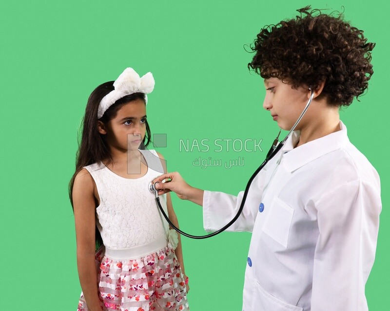 A boy looks like a doctor is examining a girl