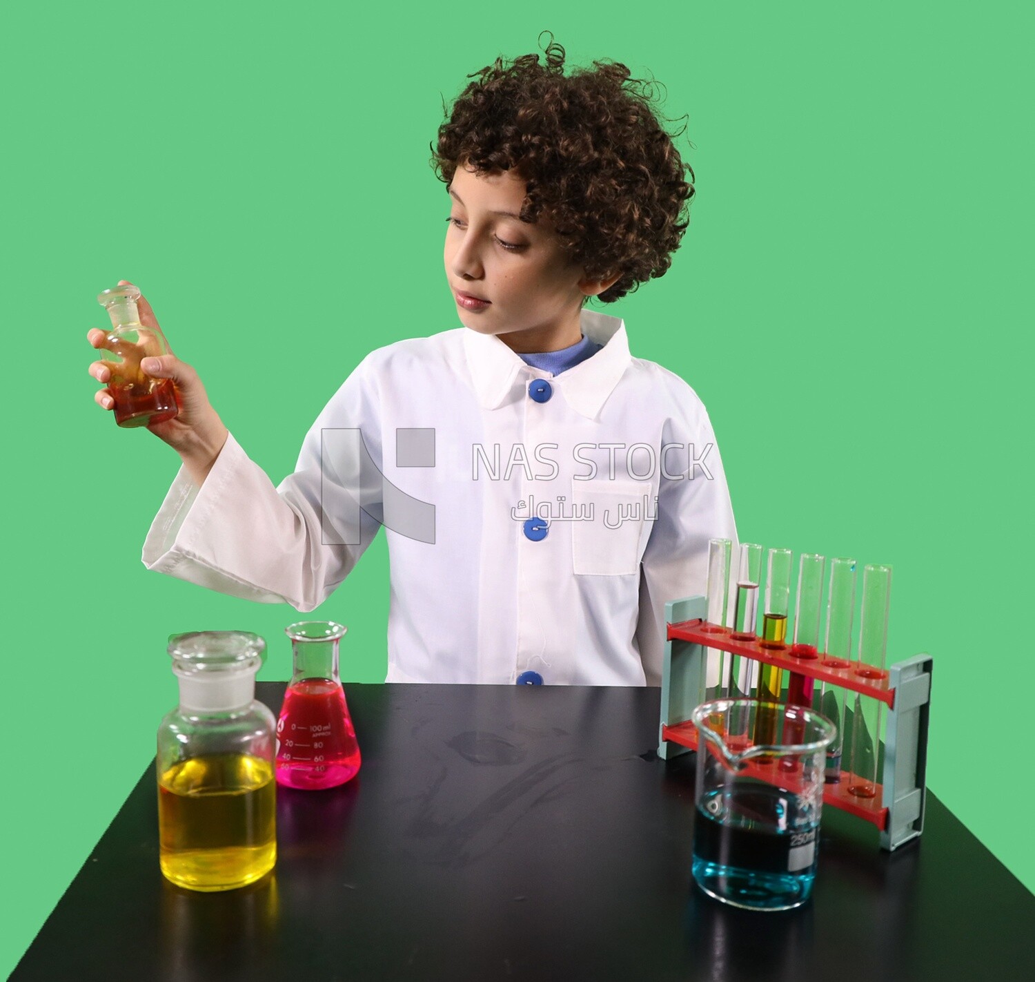 A boy looks like he is in a laboratory