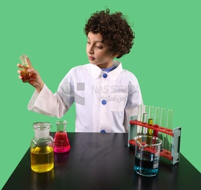 A boy looks like he is in a laboratory