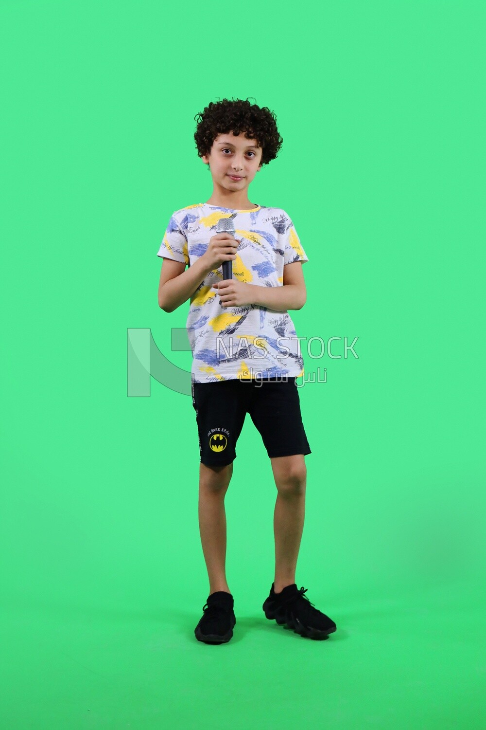 A boy holding a microphone
