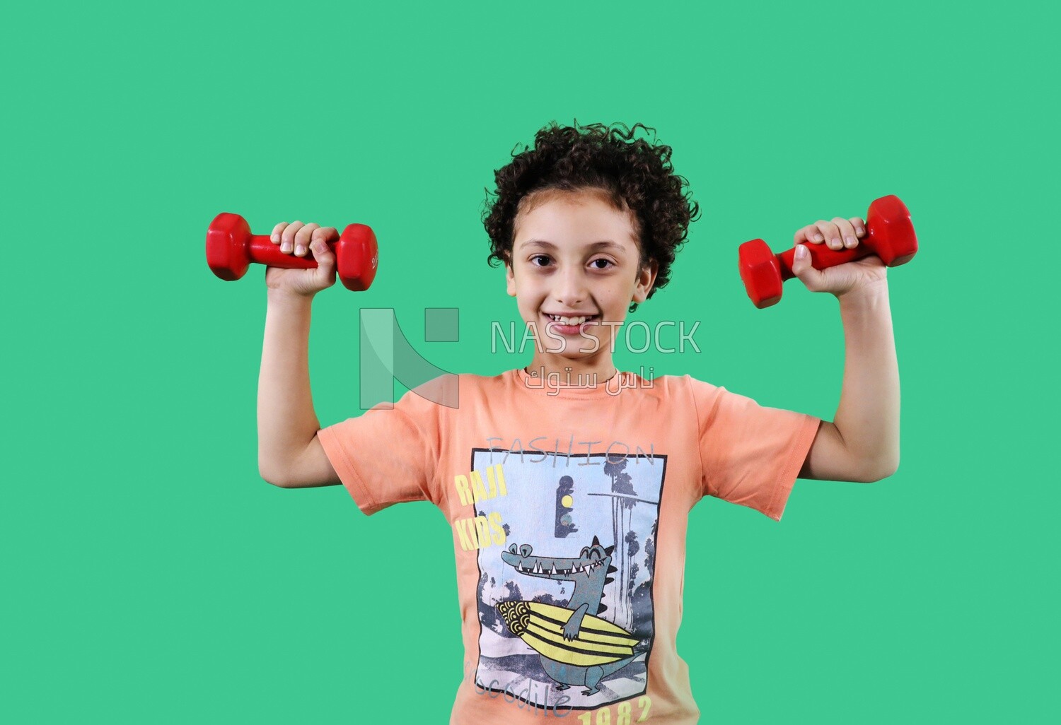 A girl holding dumbbells