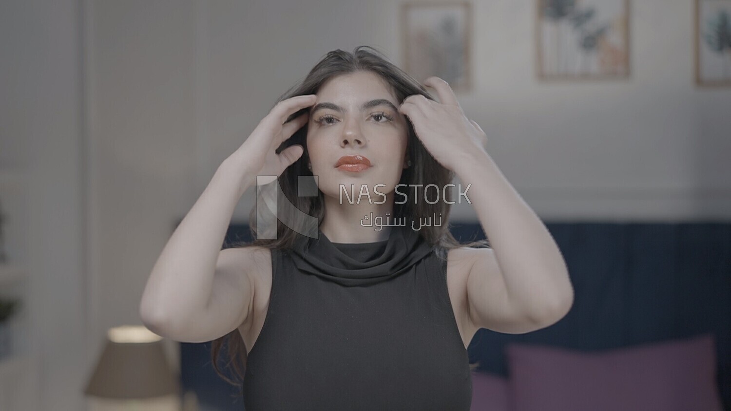 a woman checking herself in front of the mirror to get out