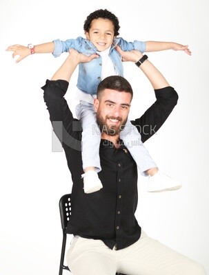 A man sitting on the chair with his boy