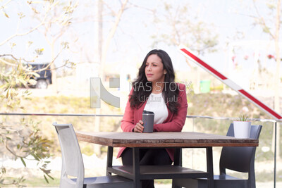 Woman sitting in the table