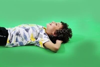 A boy sleeping on the floor