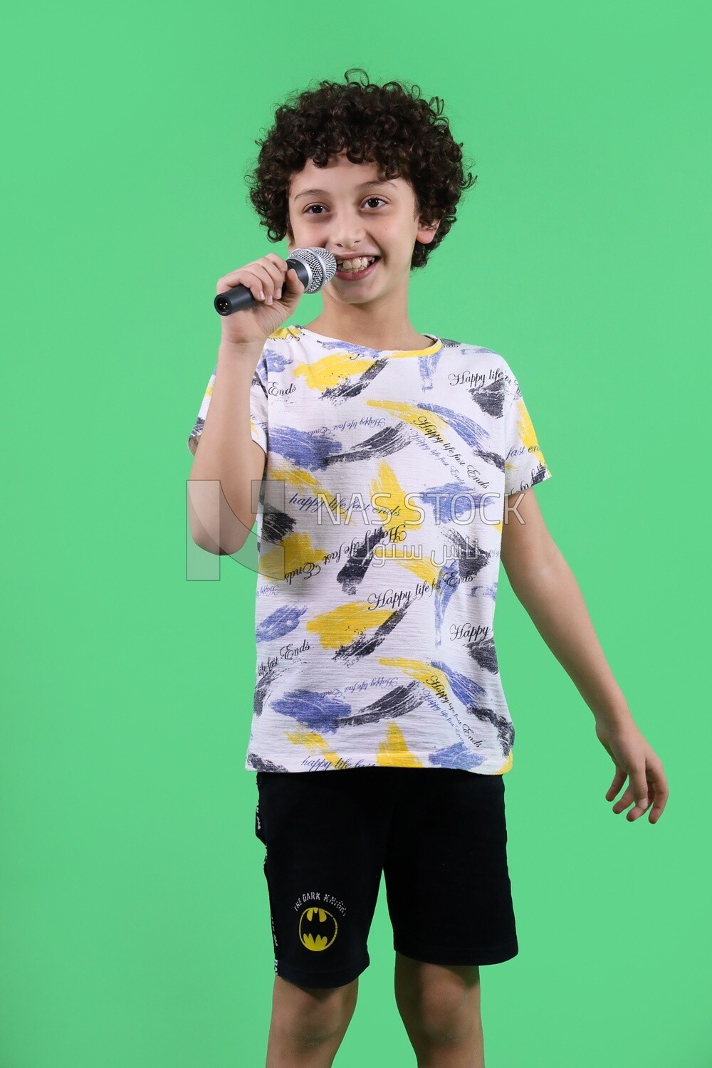 A boy holding a microphone