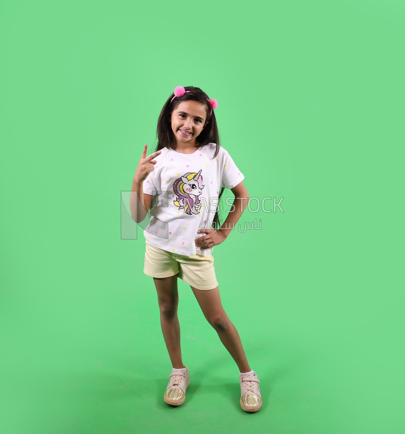A small girl on a green background