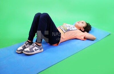 A boy sleeping on the floor