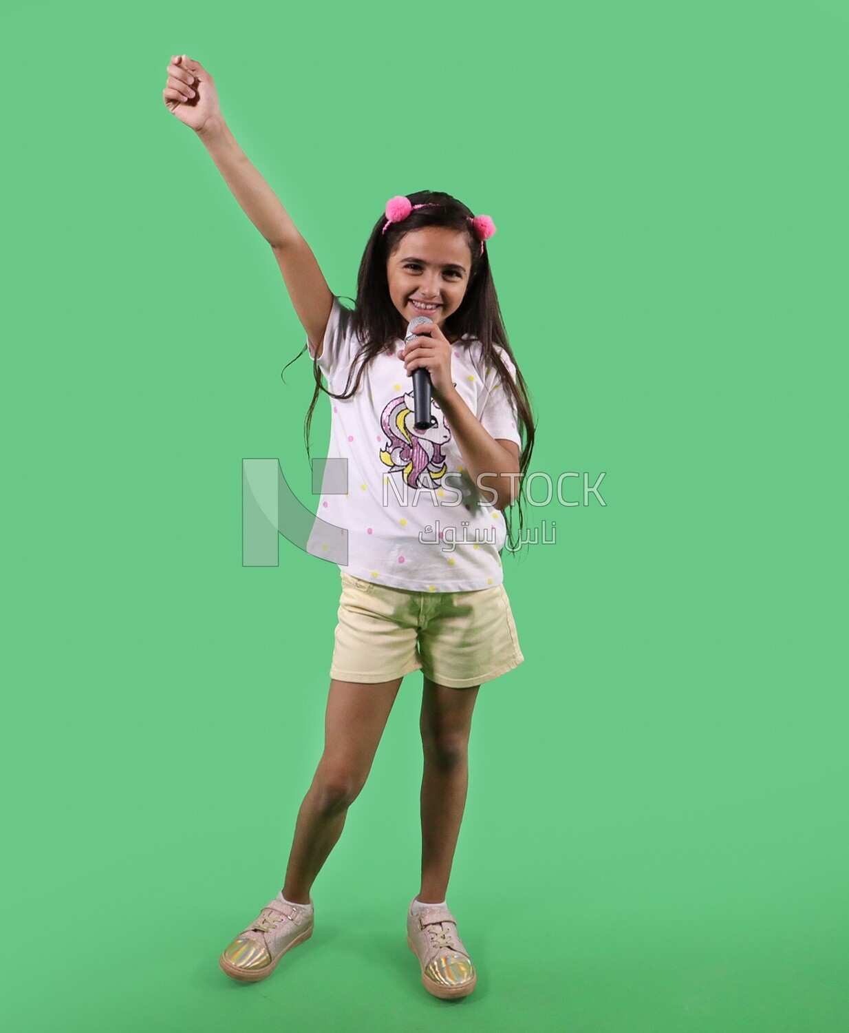 Small girl holding a microphone