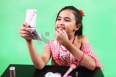 Small girl sitting at the table