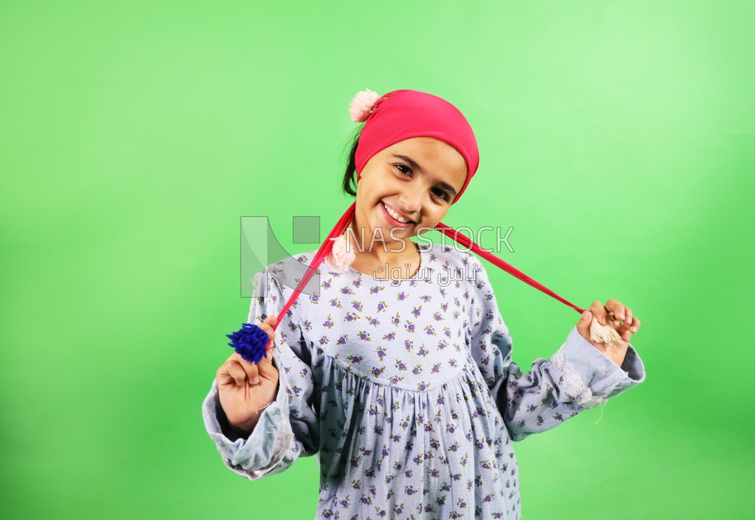 A small girl wearing egyptian farmer&#39;s clothes