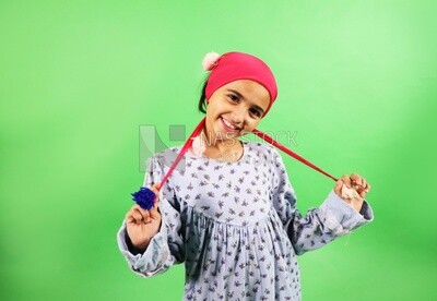 A small girl wearing egyptian farmer&#39;s clothes