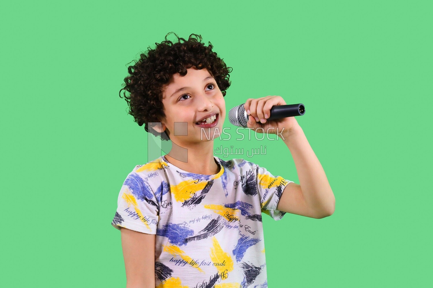 A boy holding a microphone