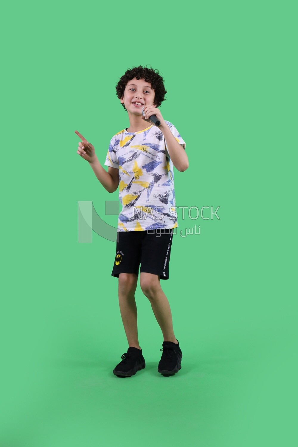 A boy holding a microphone