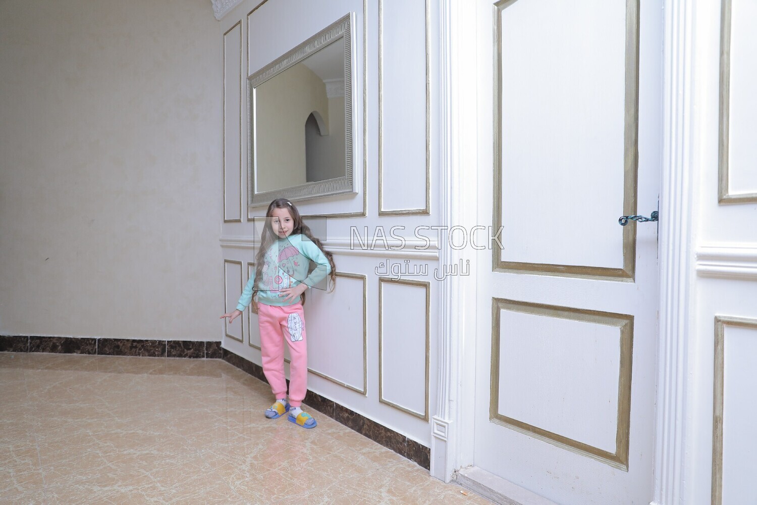 a girl standing in the living room