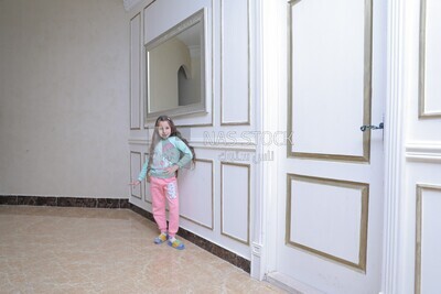 a girl standing in the living room
