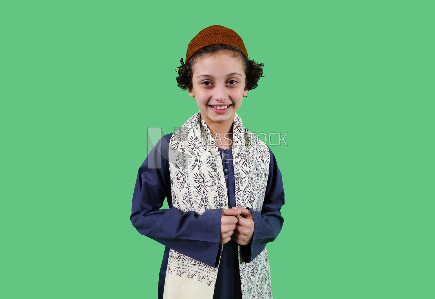 A boy wearing egyptian farmer's clothes
