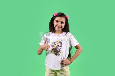 A small girl standing on a green background