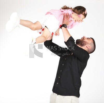 A father carrying his daughter