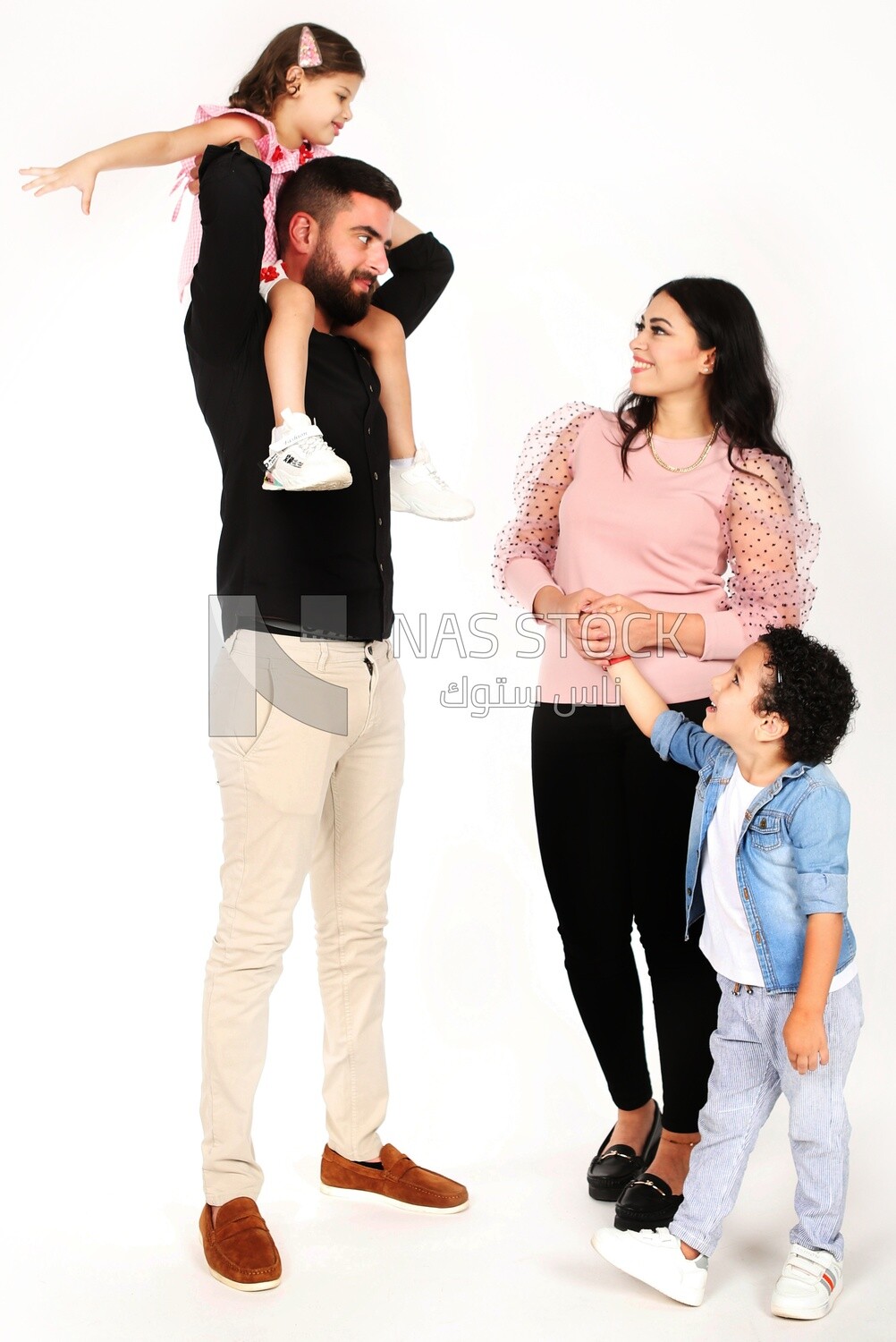 A family of four standing