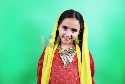 A small girl wearing egyptian farmer&#39;s clothes