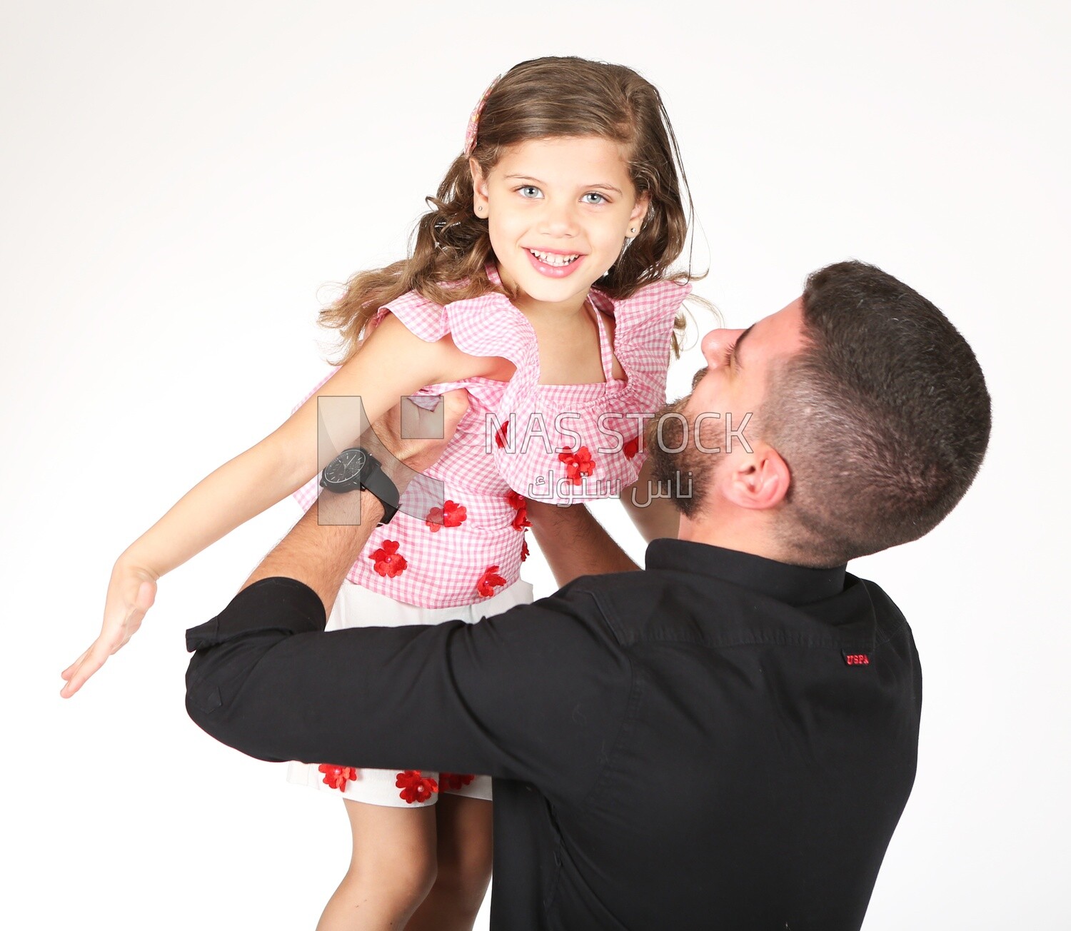 A father carrying his daughter