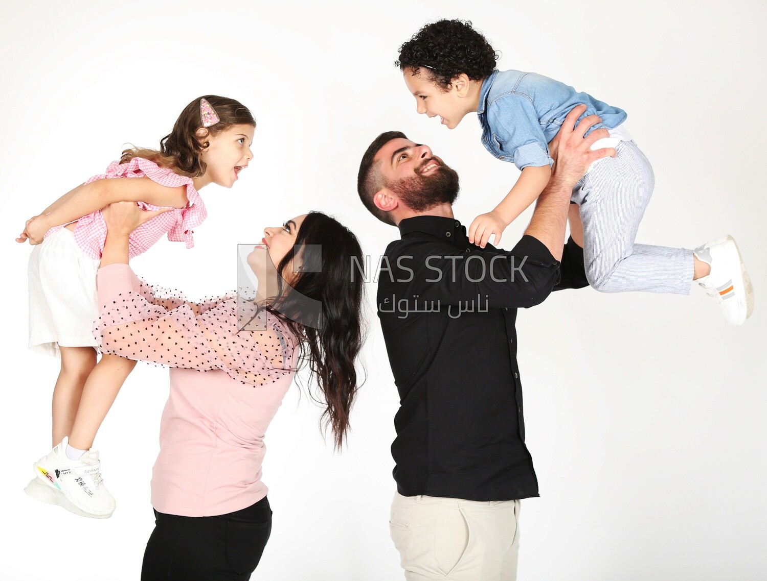 A family of four standing