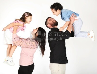 A family of four standing