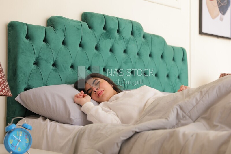 a woman sleeping in bed