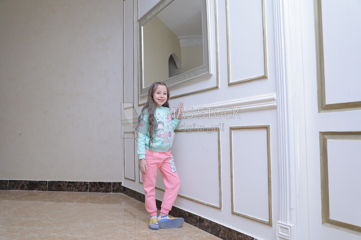 a girl standing in the living room