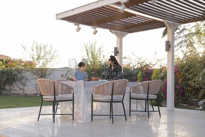 a mother preparing the dining table in the garden