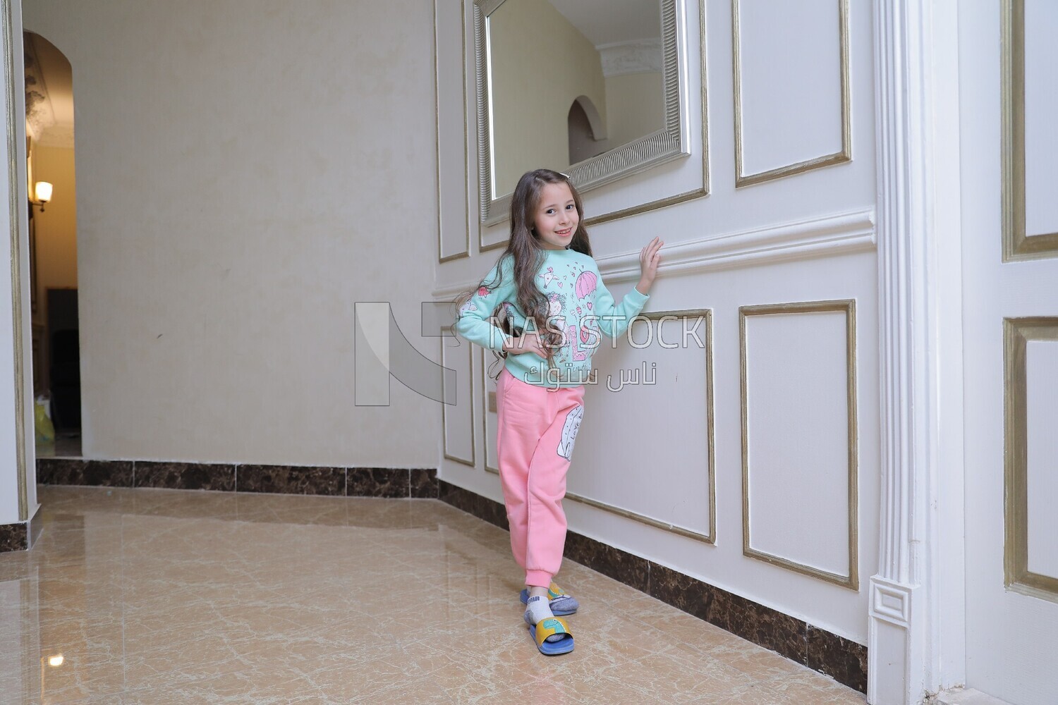 a girl standing in the living room