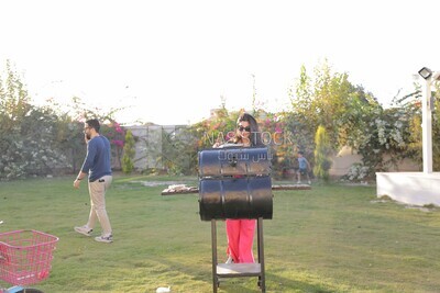 woman preparing food on a barbecue grill