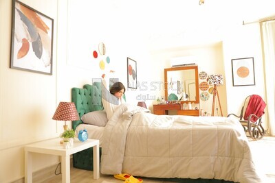 a woman sitting in bed waking up